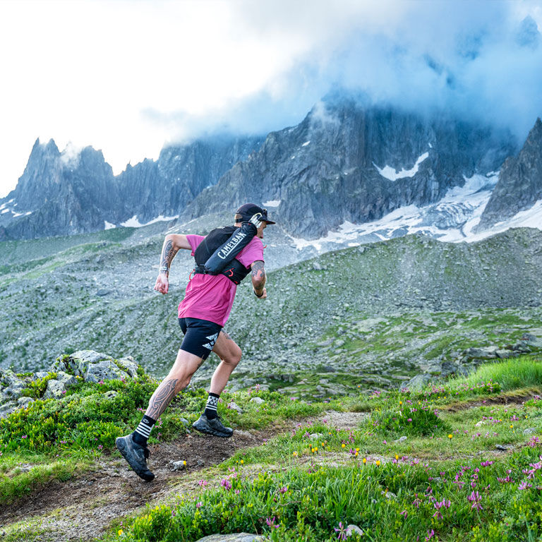 Man running with an Apex running vest